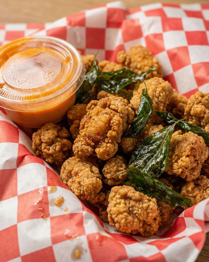 Fried chicken in a red checked basket
